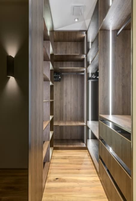 Luxury walk-in dressing room with integrated LED lighting